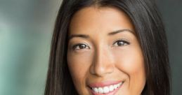 Joy Lanceta Coronel, smiling with long dark hair, showcasing a radiant look in a soft-pink top against a blurred background.