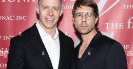 Gabe Von Ranson and companion pose at a formal event, showcasing stylish attire and a vibrant background.