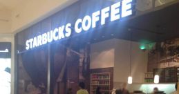 Starbucks store interior with customers enjoying coffee and pastries in a cozy atmosphere, ideal for a relaxing break.