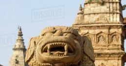 Stone lion statue at ancient temple, showcasing intricate carvings and historic architecture. Cultural heritage in focus.