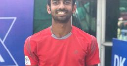 Megh Patel proudly holds his trophy, celebrating victory in the Boys U18 Doubles at the Fenestral Open tournament.