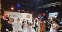 Children performing in white outfits at an event, with a spotlight on entertainment and celebration. Роман Степанов involved.