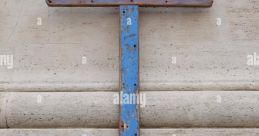 Rusty blue cross mounted against a textured wall, symbolizing faith and resilience. Ideal for discussions on spirituality.