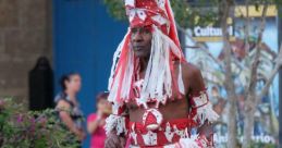 Traditional Balasasirekha FSN dancer in vibrant red and white costume, showcasing cultural heritage and lively performance.