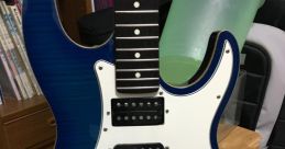 Blue electric guitar featuring multiple pickups and a sleek design, perfect for guitar enthusiasts and players.