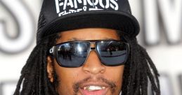 Lil' Jon wearing a "FAMOUS" cap and sunglasses, showcasing his signature style at a music event.