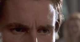 Intense close-up of a character from American Psycho, showcasing a chilling expression that reflects inner turmoil.