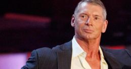 Vince McMahon in a sleek suit, exuding confidence, a key figure in wrestling and entertainment industry leadership.