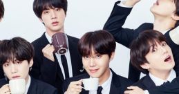 BTS members in stylish suits enjoying drinks, showcasing their charismatic personalities and brotherly bond at a photoshoot.