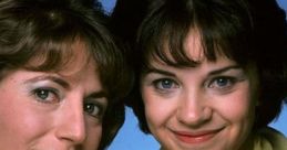 Laverne and Shirley share a cheerful moment, showcasing their iconic 70s fashion and playful friendship.