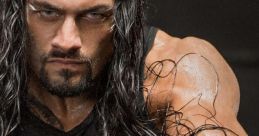 Roman Reigns showcases strength and intensity while gripping a chain, exuding power in a dramatic pose.