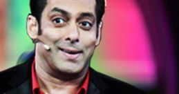 Salman Khan engaging with the audience on Bigg Boss, showcasing his lively personality in a vibrant studio setting.