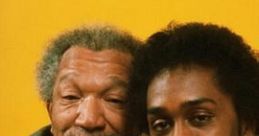 Fred Sanford and Lamont Sanford share a moment in this iconic duo from the classic sitcom "Sanford & Son.