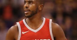 Chris Paul in a red Houston Rockets jersey, showcasing his skills during an intense NBA game with a basketball.