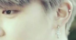 Close-up of a character from "Flower Boys Bangtan High School Mini Drama," showcasing stylish earrings and soft hair.