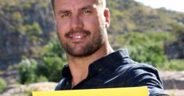 Host of The Amazing Race Australia holding the iconic yellow and black race sign against a scenic backdrop.