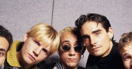 Backstreet Boys posing together, showcasing their iconic looks and personalities from the peak of their music career.