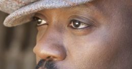 Close-up portrait of Anthony Hamilton showcasing his distinctive style and thoughtful expression.