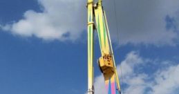 TURBO OP DE TURBO ride towering against a bright sky at a lively Kermis event, showcasing vibrant colors and excitement.