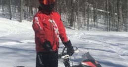 Jacob M. riding a snowmobile in a snowy forest, showcasing winter adventure and outdoor sports enthusiasm.