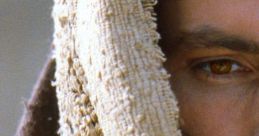 Close-up of a man’s face with a solemn expression, draped in a textured cloth, evoking themes from "The Passion of the Christ.