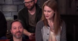 Cast of Critical Role sharing smiles during a live show, showcasing camaraderie and excitement among players.