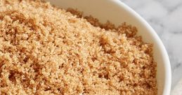 Close-up of brown sugar in a bowl, showcasing its rich color and fine texture, perfect for baking and sweetening recipes.