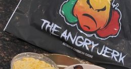 Delicious Caribbean dish from The Angry Jerk featuring savory meats, sides, and vibrant flavors on a decorative platter.