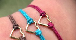 Frienship bracelets The of friendship bracelets being fastened is a delicate click, almost like the of a lock securing a