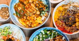 Colorful array of bowls featuring fet mok dishes with fresh ingredients, garnishes, and unique toppings for a vibrant meal.