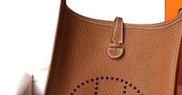 Hermès brown leather bag with perforated logo and strap, elegantly presented in an orange box for luxury fashion lovers.