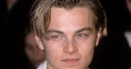 Young Leonardo DiCaprio with styled hair and a sharp suit, showcasing his early Hollywood charm and charisma.