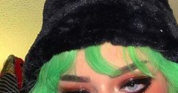 E-Girl aesthetic featuring vibrant green hair, bold makeup, and a stylish black bucket hat for a trendy look.