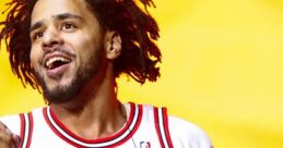 J. Cole performing in a Chicago Bulls jersey, showcasing his vibrant energy against a colorful backdrop.