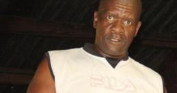 Athlete from Themba, Zulu South Africa, wearing boxing gloves and a sleeveless shirt, ready for training in the gym.