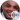 Charles Barkley smiling at an event, showcasing his charismatic personality and signature bald look.