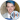 DanTDM smiles at an event, showcasing his signature blue hair and stylish attire, highlighting his vlogger persona.