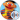 Ernie from Sesame Street smiles while holding a yellow rubber duck, wearing a colorful striped sweater. Fun and playful!