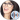 SSSniperWolf smiling with glasses, showcasing her playful personality and vibrant style, popular among gaming fans.