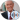 Bob Barker smiles in a formal suit with a red patterned tie, showcasing his iconic television persona.