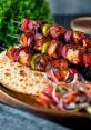 Delicious WHALA KEBAB skewers with grilled vegetables served on flatbread, accompanied by fresh salad. Perfect for flavorful bites!