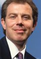 Portrait of Tony Blair, former UK Prime Minister, showcasing his signature smile and business attire against a blue backdrop.