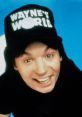 Smiling man wearing a "Wayne's World" cap, capturing the iconic spirit of this classic comedy series.