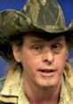 Ted Nugent speaking passionately, wearing a camo cowboy hat, showcases his unique style and energetic personality.