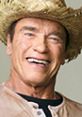 Arnold Schwarzenegger smiling in a straw hat, showcasing his charismatic personality and German heritage.