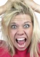 Screaming woman with wild blonde hair, expressing intense emotion and frustration, eyes wide and mouth agape.