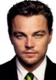 Leonardo DiCaprio portrays Jordan Belfort in The Wolf of Wall Street, showcasing ambition and charm in a sharp suit.