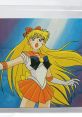 Sailor Venus from DiC anime, in her iconic outfit, passionately poses with flowing blonde hair and confident expression.