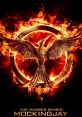 Iconic Mockingjay symbol engulfed in flames, representing rebellion in The Hunger Games: Mockingjay, Part 1 Trailer.