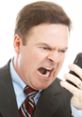 Angry customer yelling into a phone, expressing frustration with poor service or product issues in a business setting.